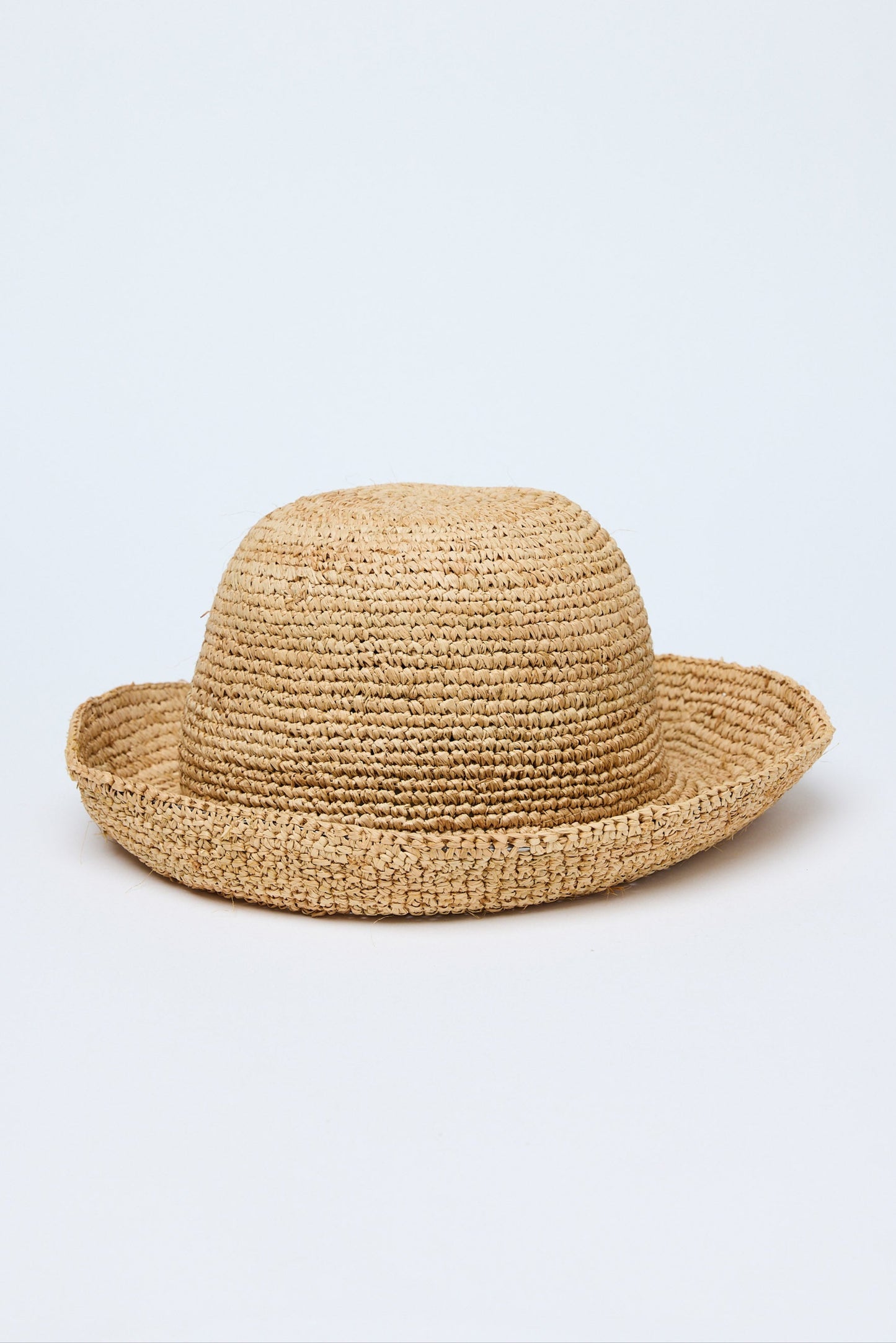 Beige straw hat on a light gray background