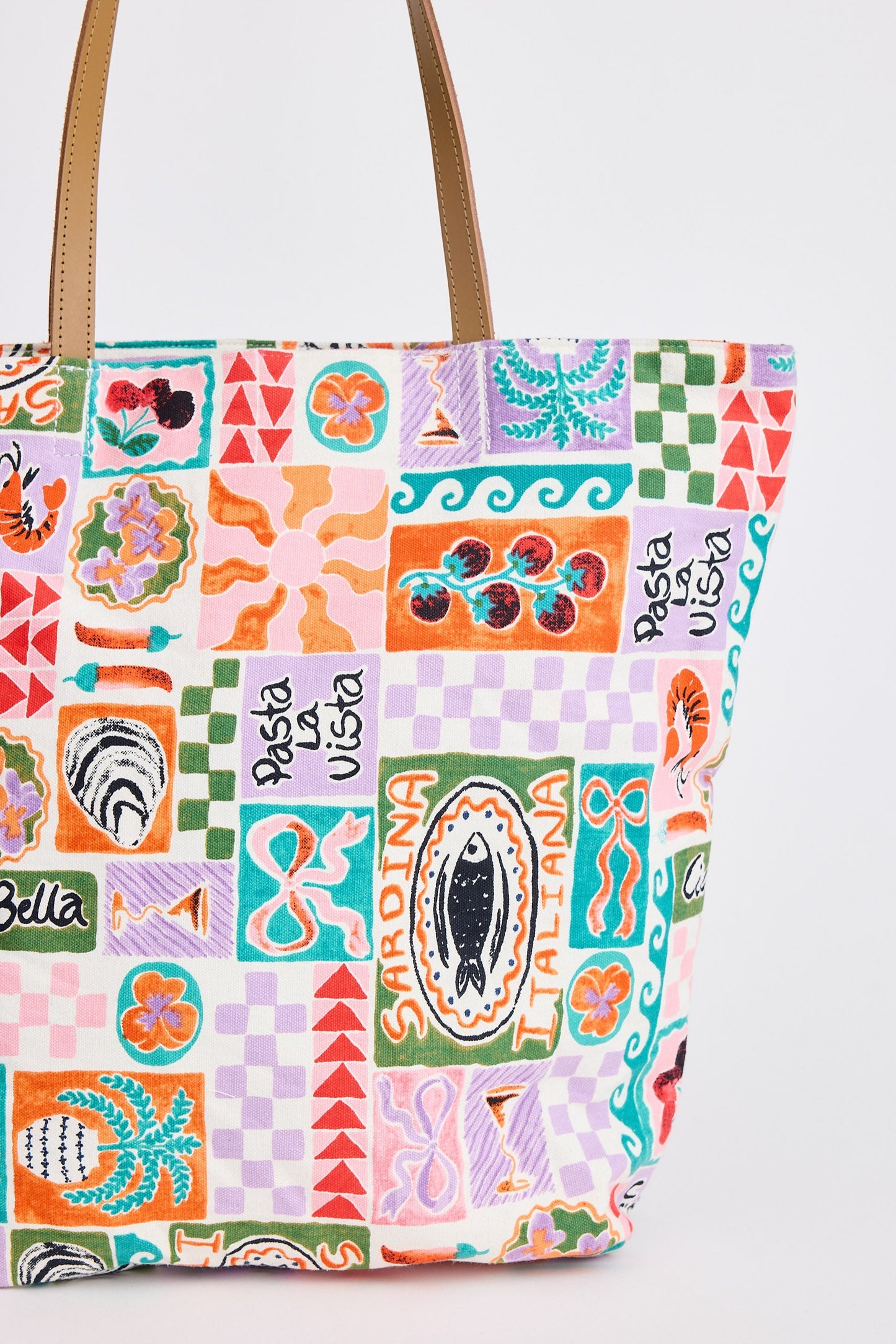 Colorful patterned tote bag with text on a white background