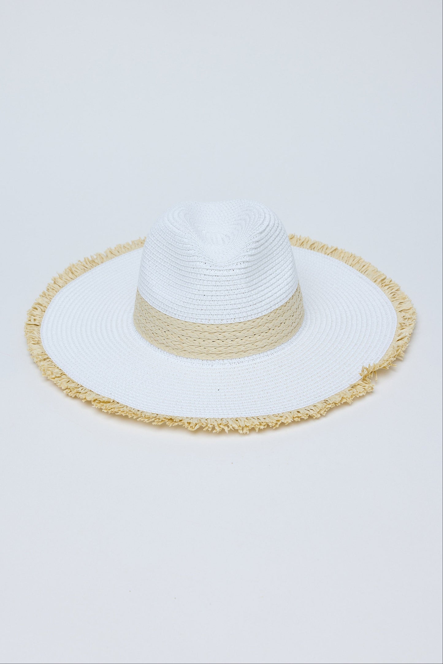 White sun hat with a natural band on a light gray background