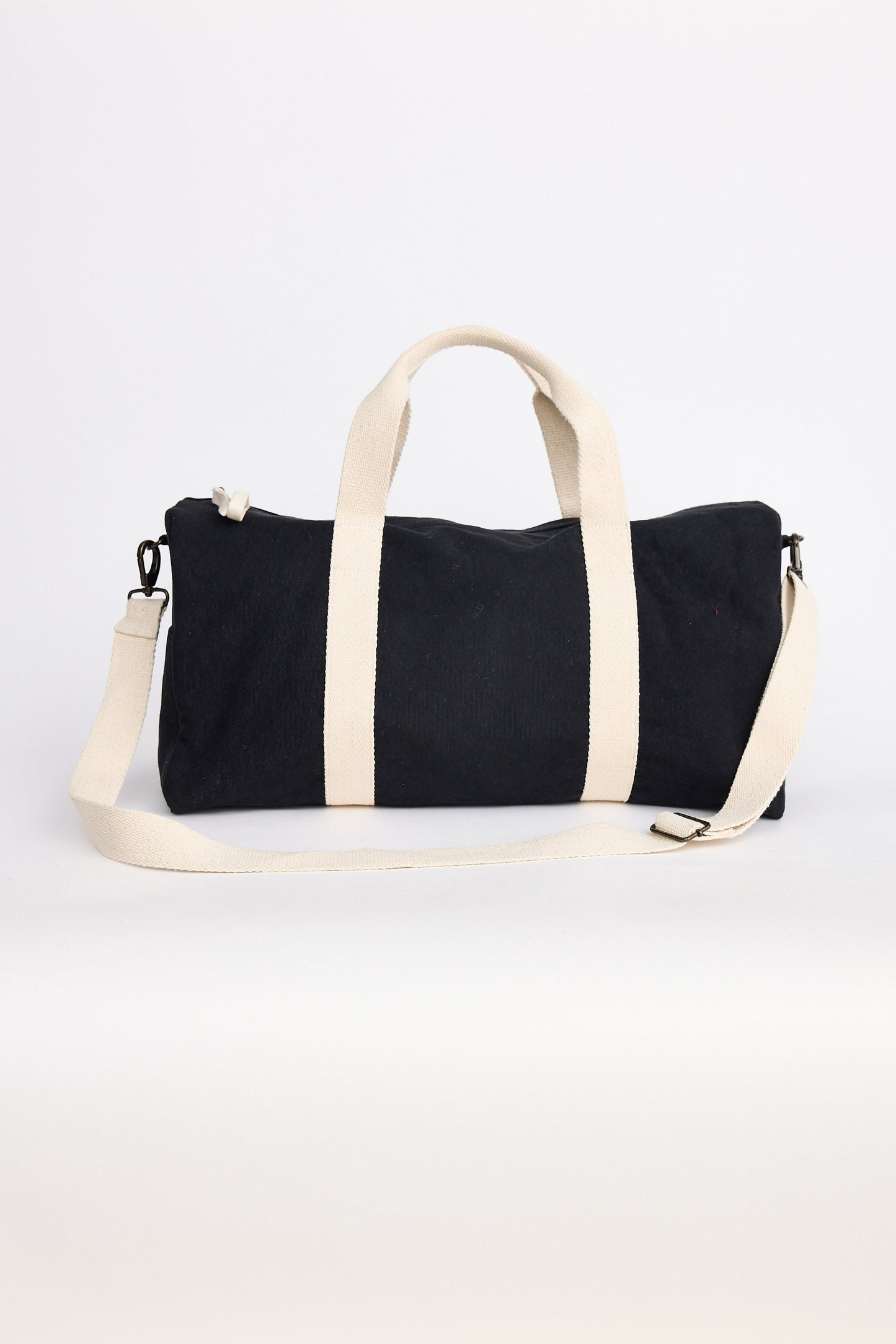 Black and white duffel bag on a white background