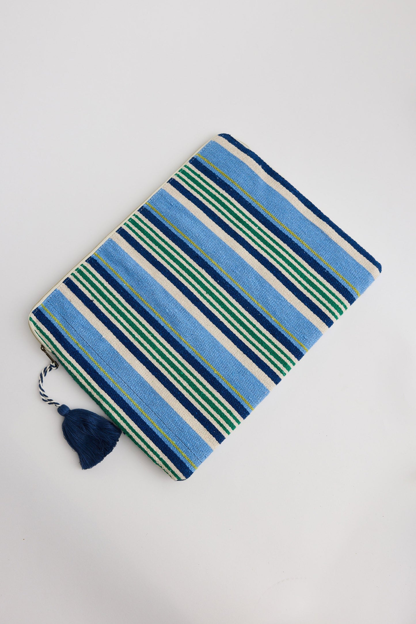 Striped fabric with blue and green pattern on a white background