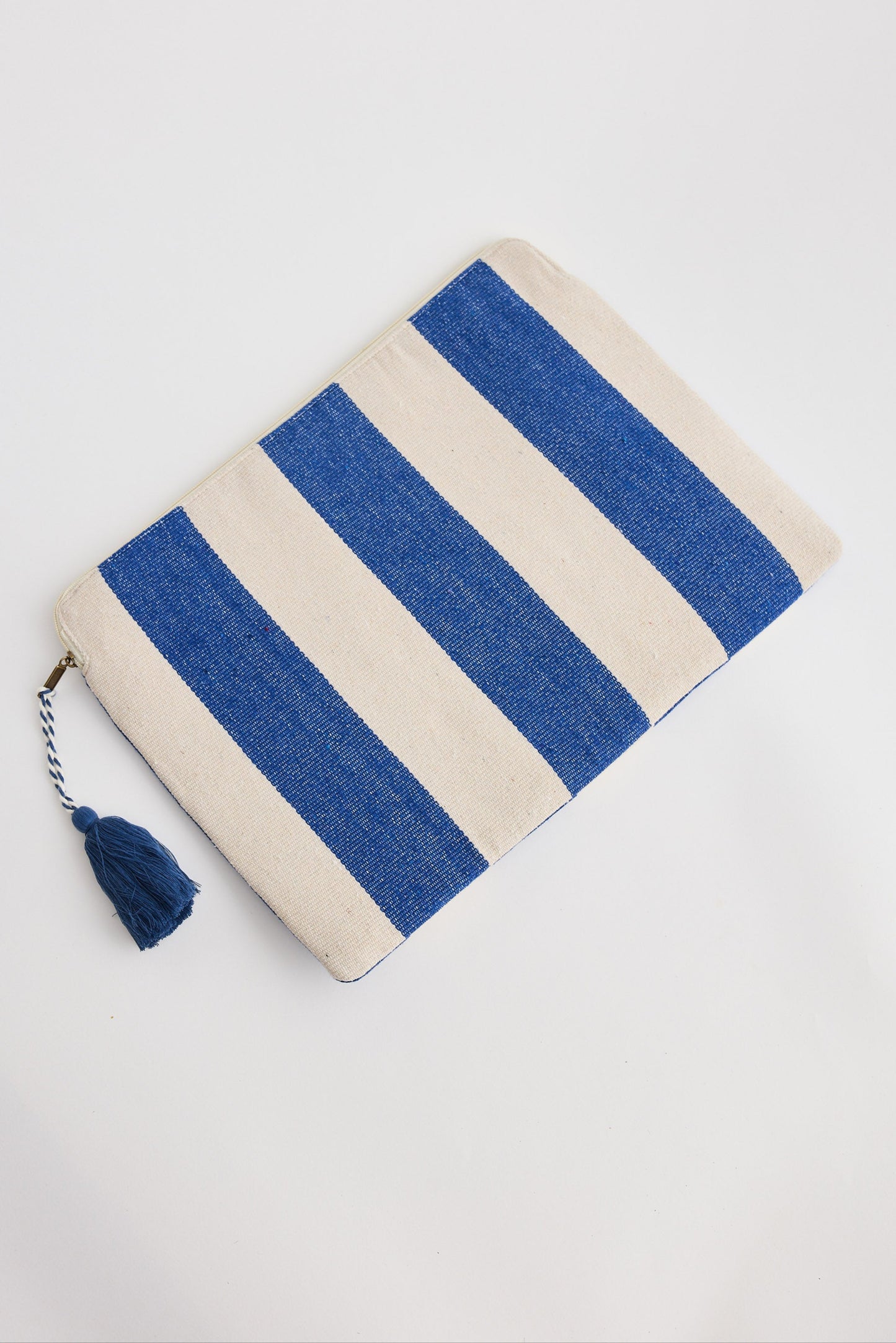 Striped pouch with blue and beige colors on a white background