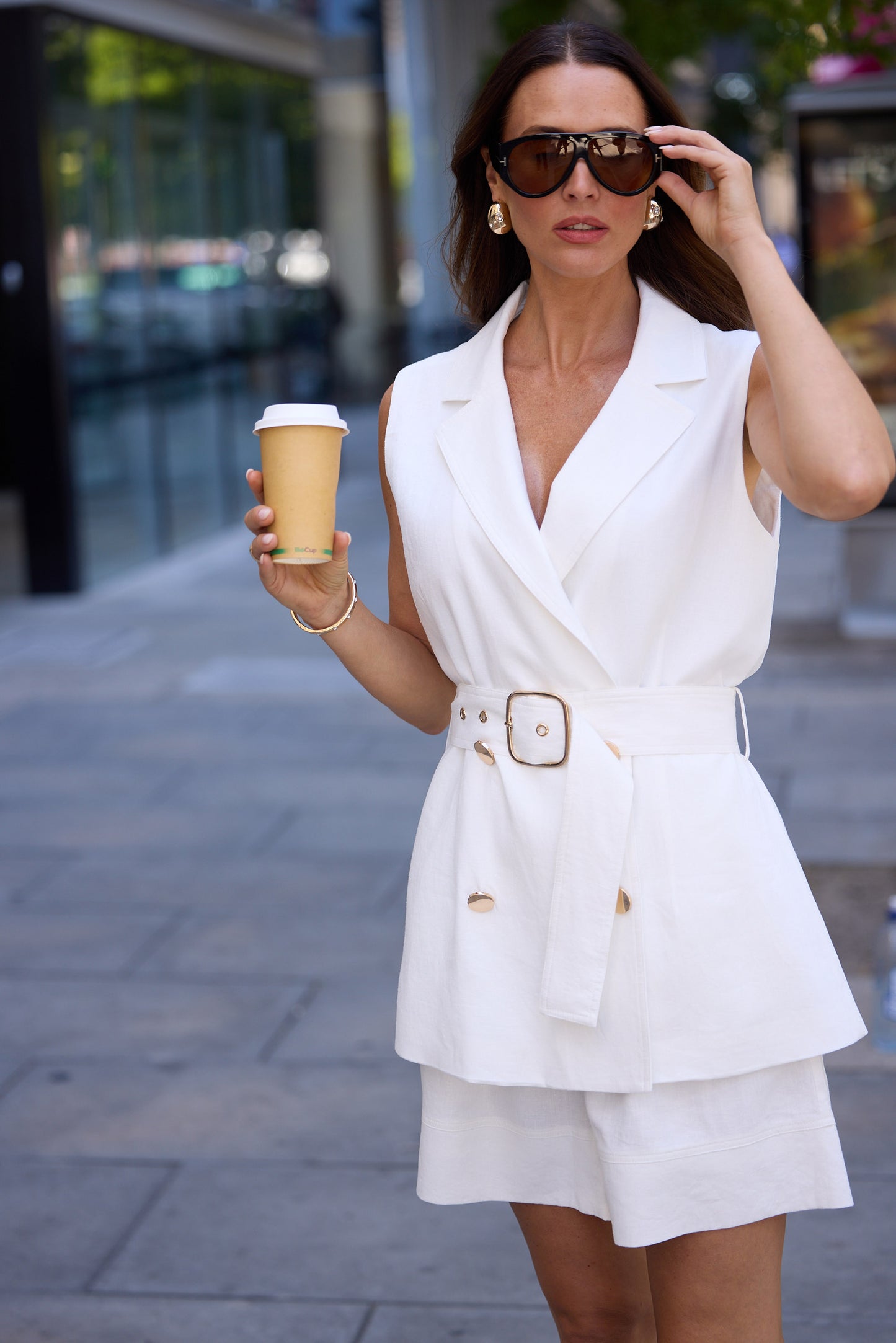 Model wearing brown paparazzi sunglasses