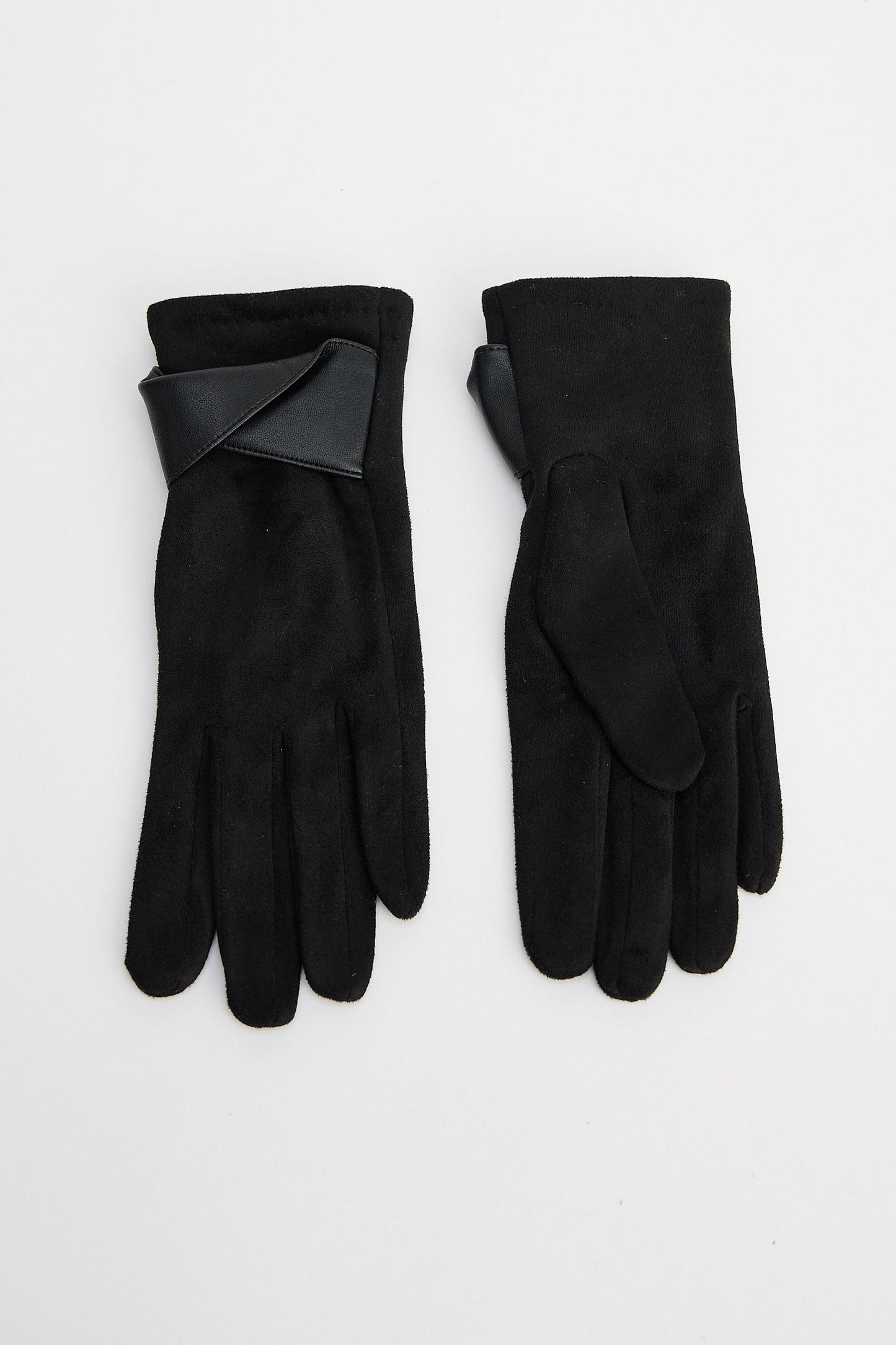 Pair of black gloves on a light gray background