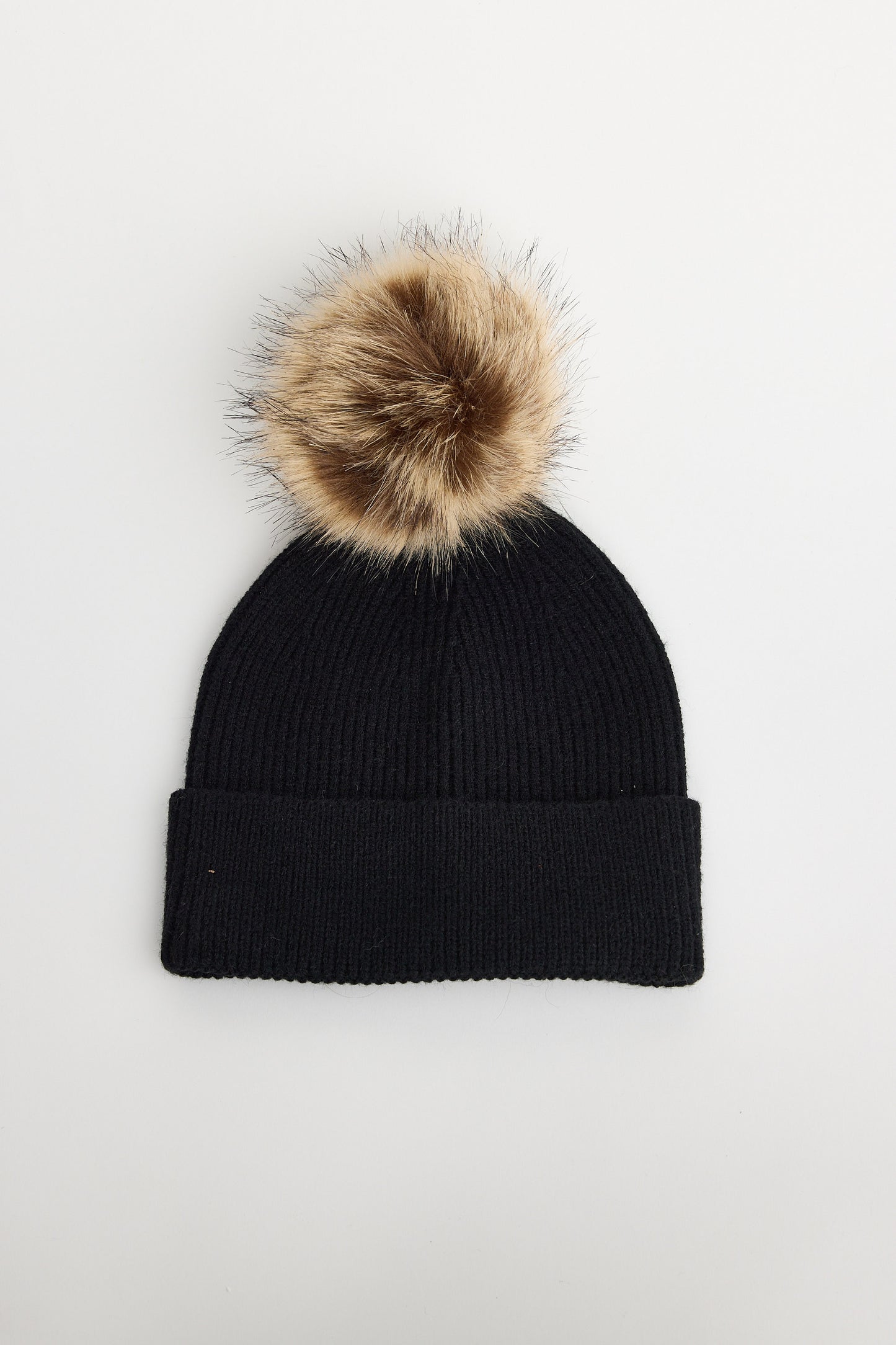 Black beanie with a brown faux fur pom-pom on a white background