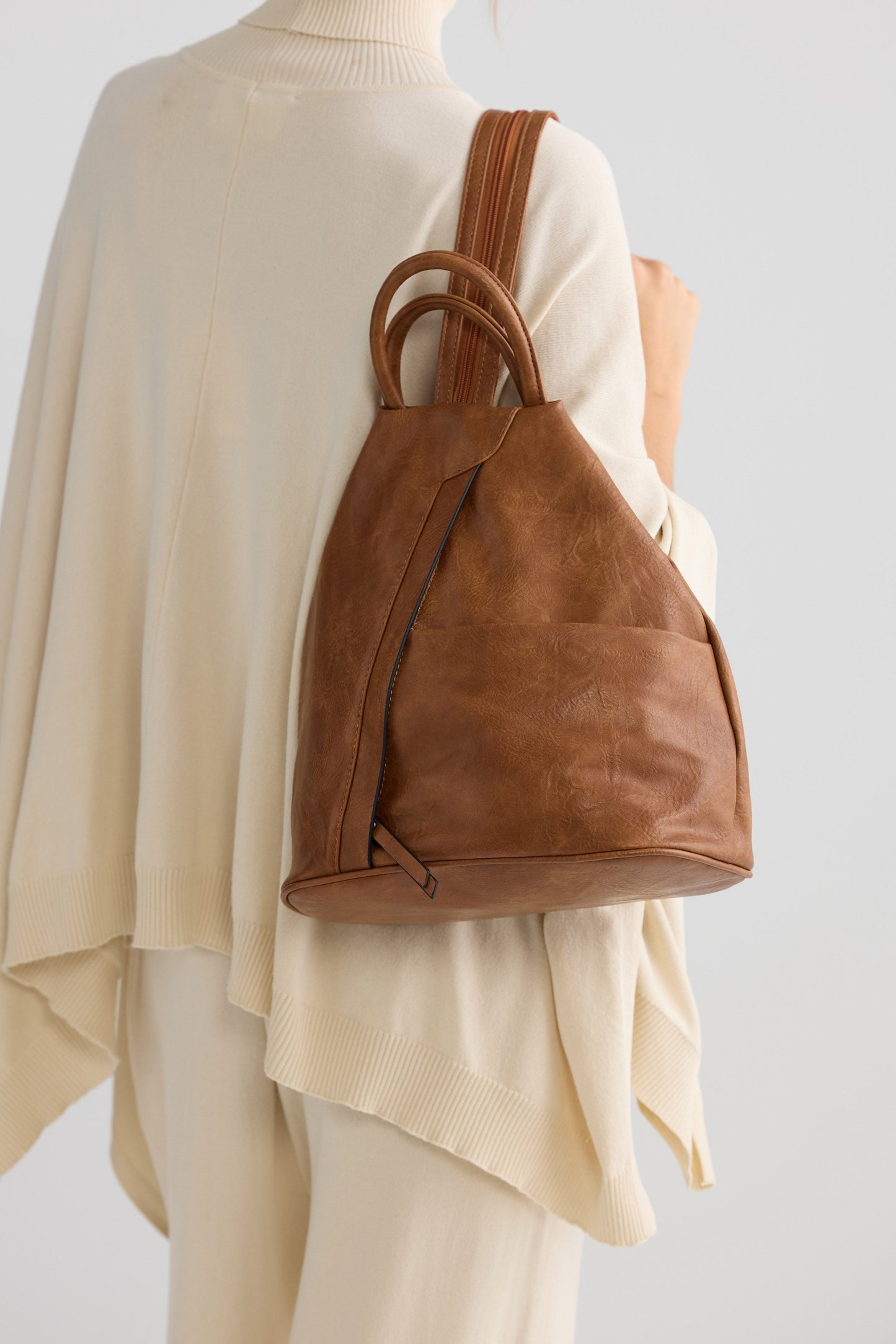 Hidden Valley Backpack - Tan backpack in tan with structured silhouette, back view on white background