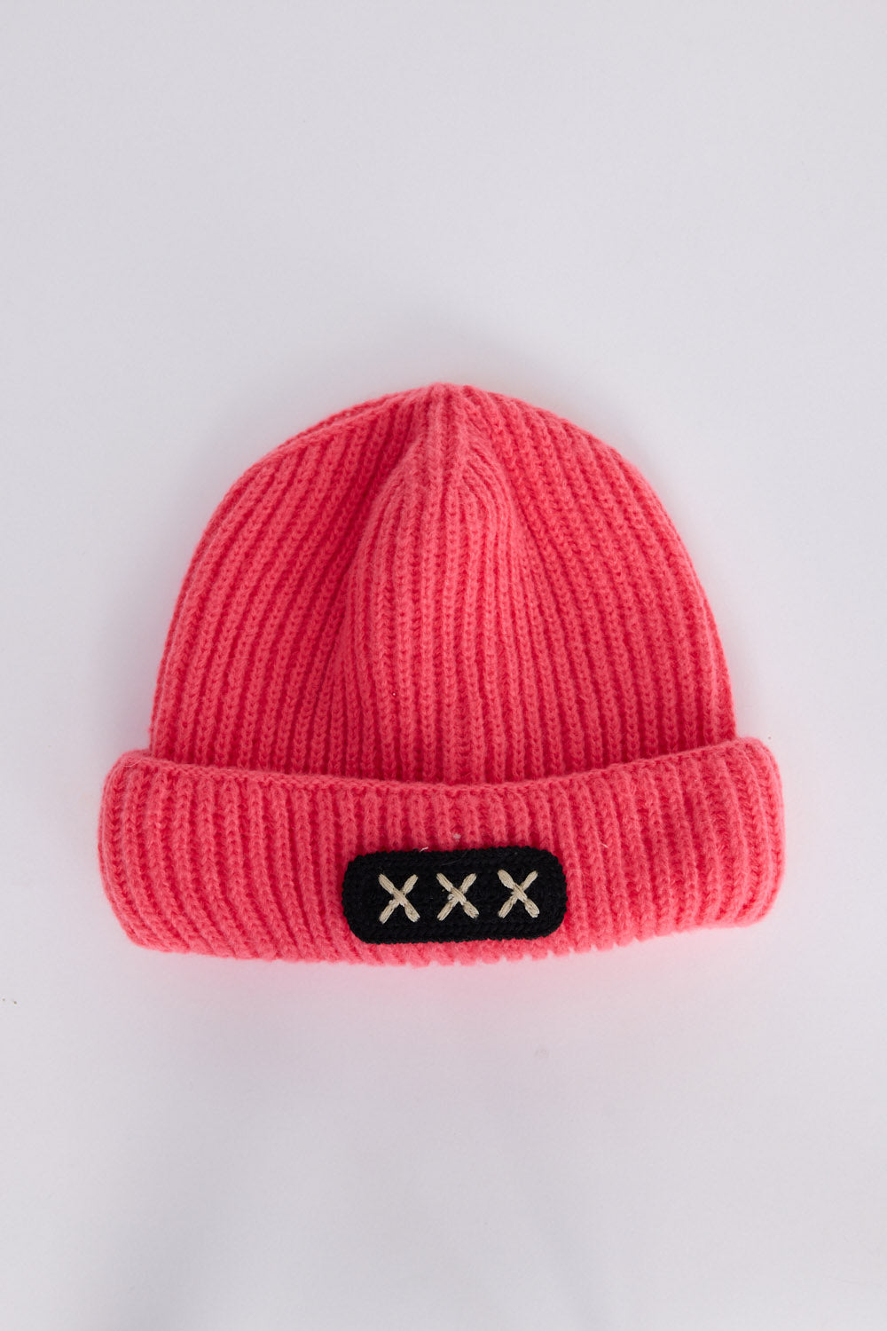 Benny Kids Beanie - Pink kids' beanie in pink with rib knit texture, front view on white background
