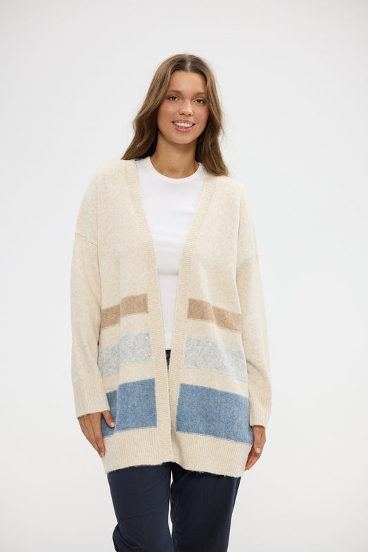 Woman wearing a patterned cardigan on a white background