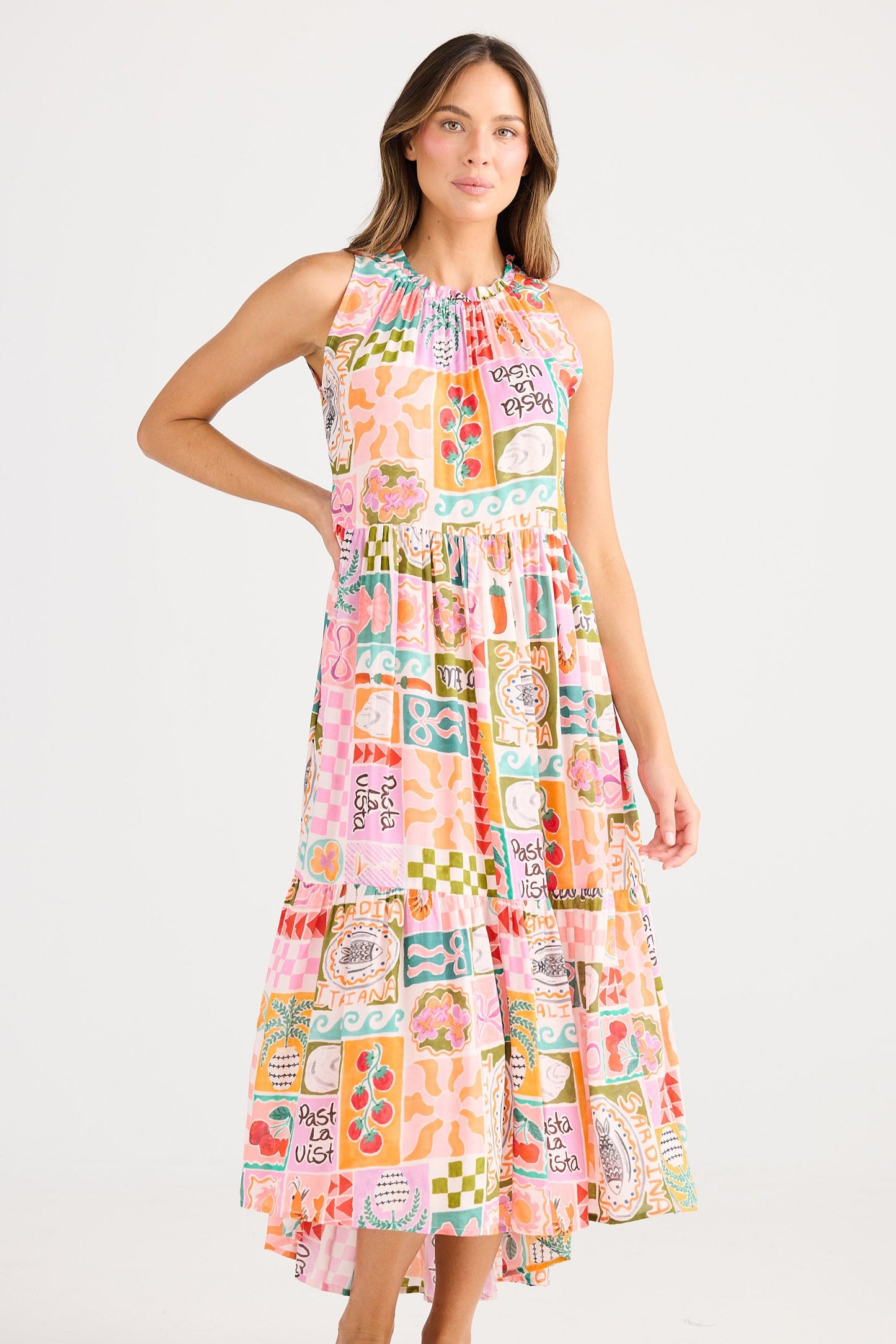 Woman wearing a colorful patterned dress on a white background