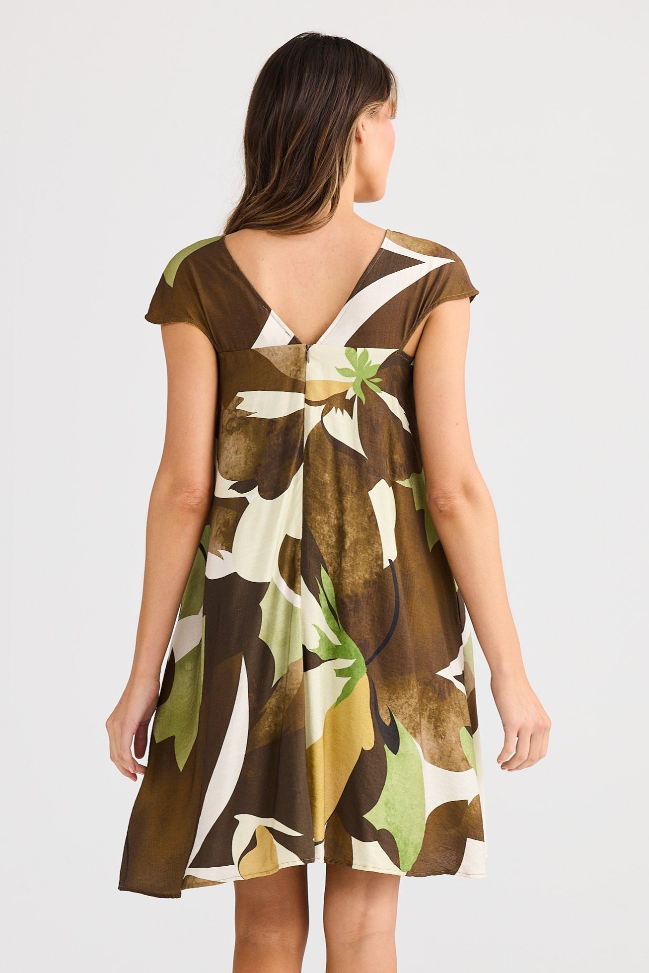 Woman wearing a floral dress on a white background