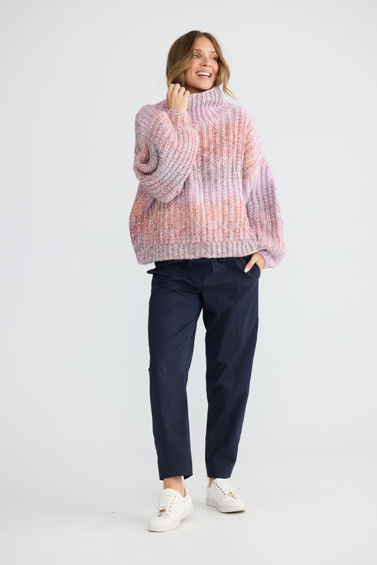 Model wearing Olas Knit Pink Ombre with chunky high neckline, front view on white background