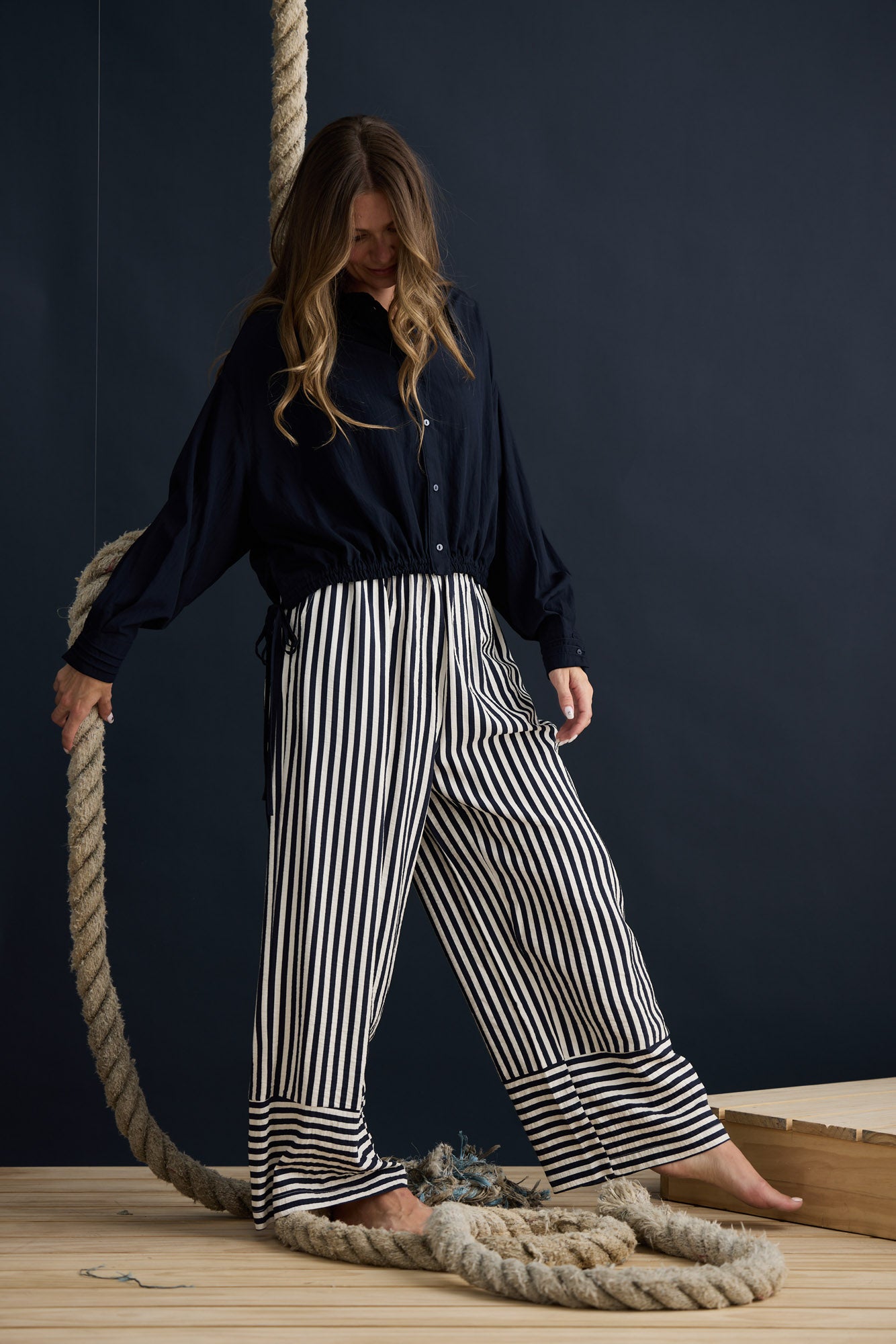 Model wearing Ripple Shirt Navy with relaxed shirt silhouette, campaign lifestyle view