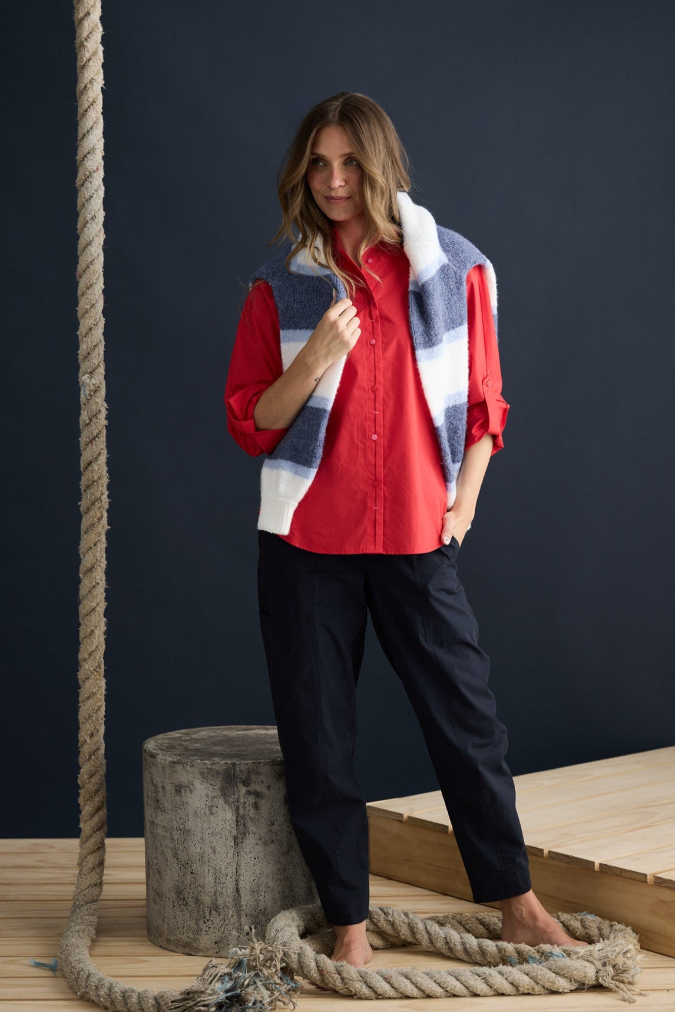 Model wearing Fae Shirt Red with contrast buttons and stitching, campaign lifestyle view