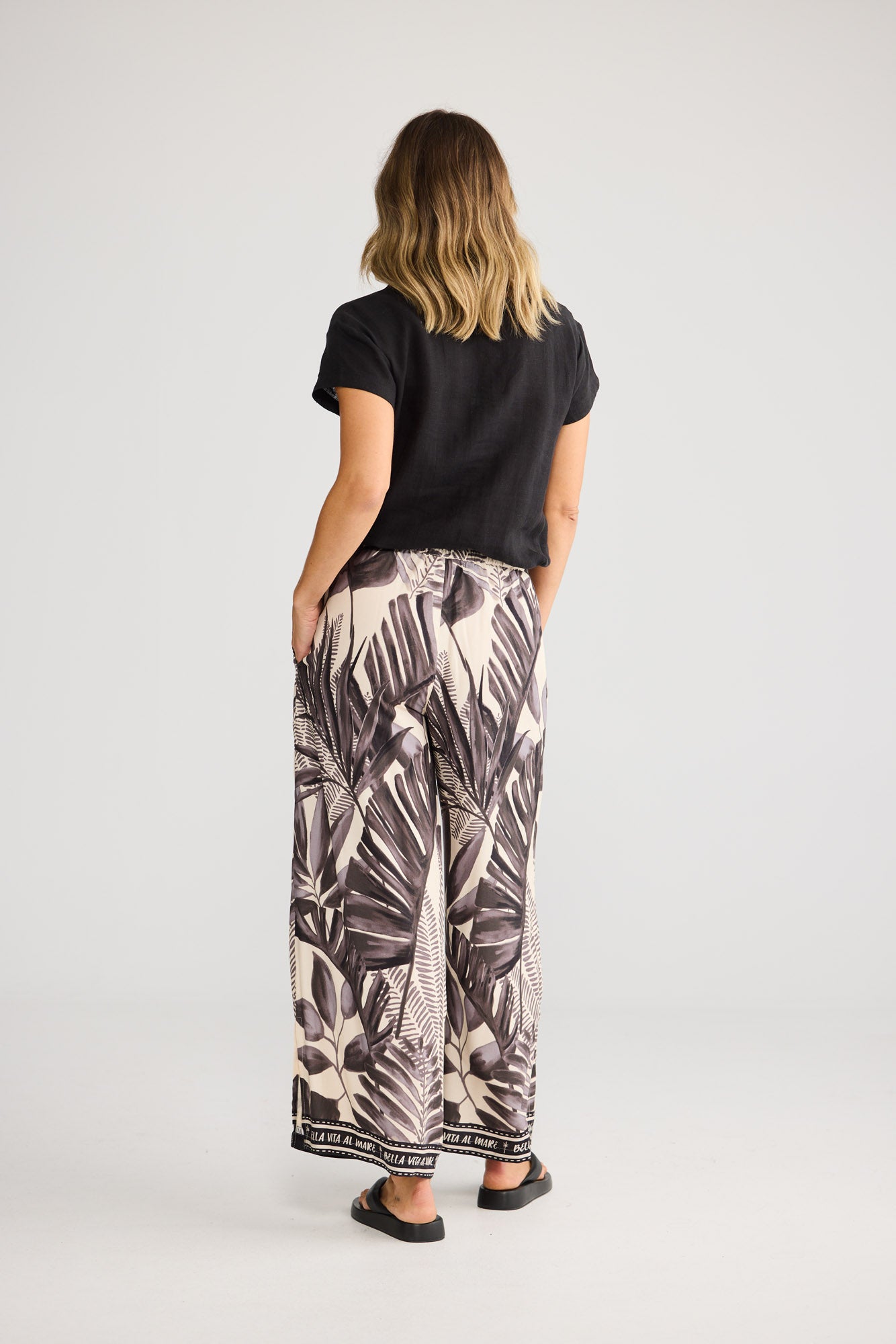 Fly Away Pant in Sunset Palm with relaxed wide leg.