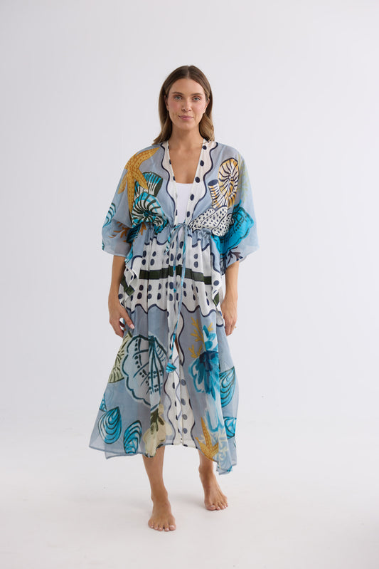 Model wearing Asta Long Kaftan in starfish dreams, front view. Open front with a drawstring waist tie.