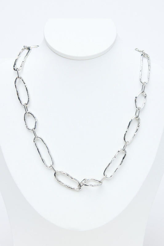 Silver chain necklace on a white background