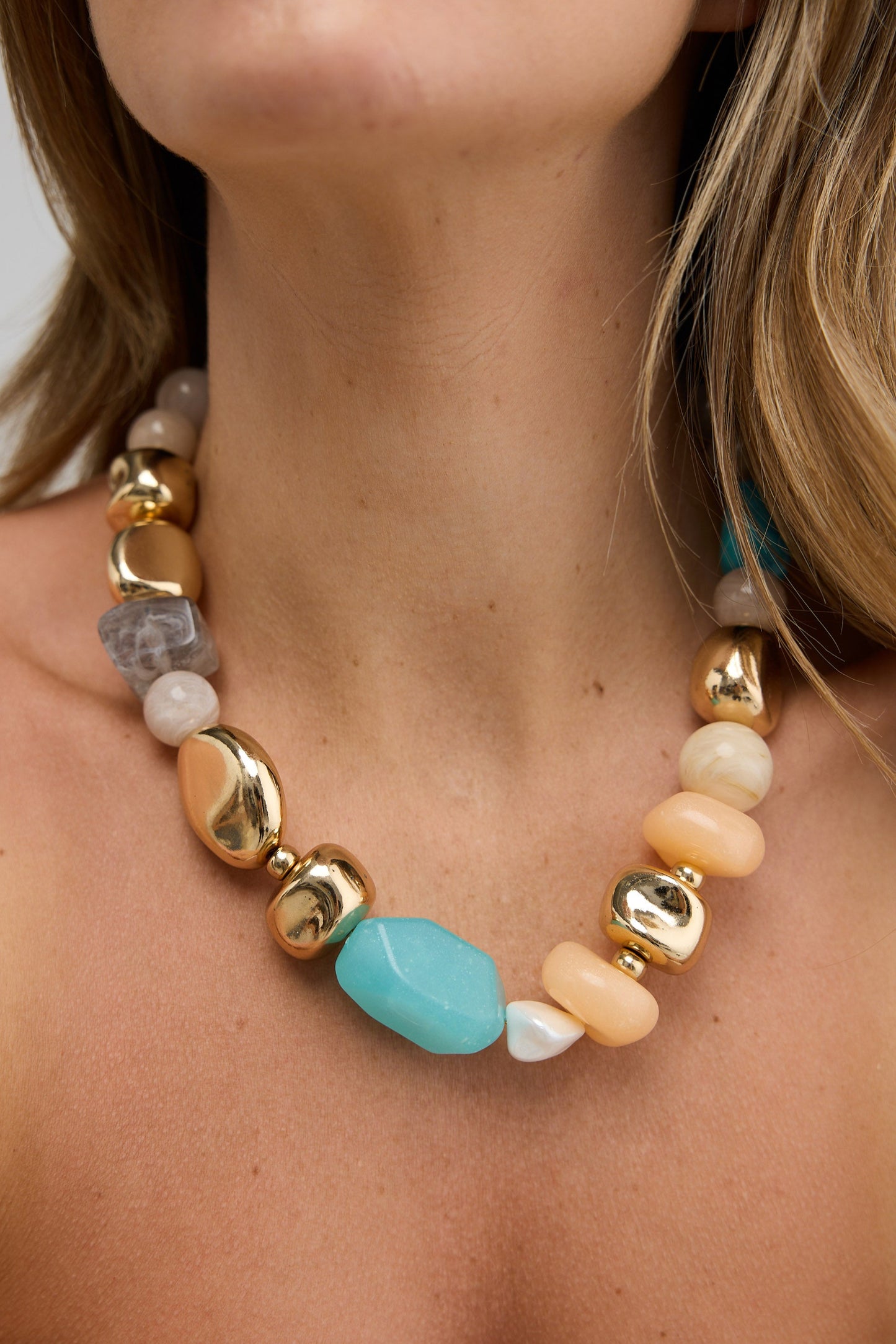Necklace with colorful beads worn by a person