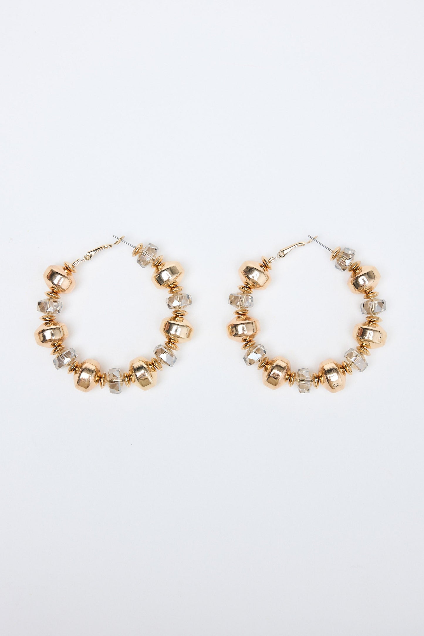 Gold hoop earrings with small beads on a white background
