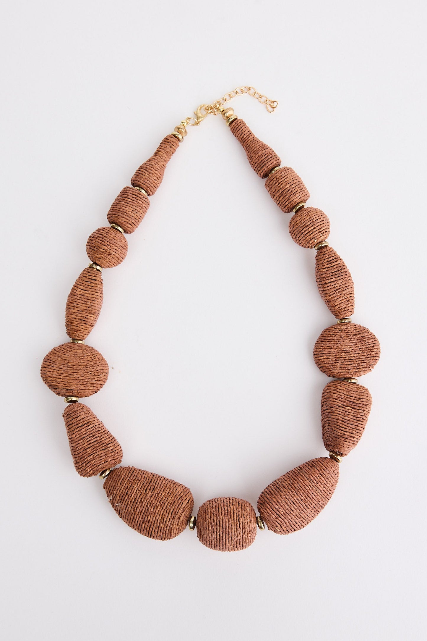 Brown beaded necklace on a white background