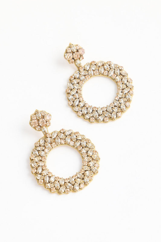 Pair of gold hoop earrings on a white background