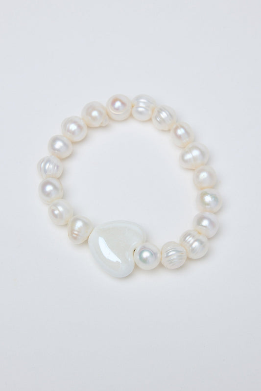 Pearl bracelet on a light gray background