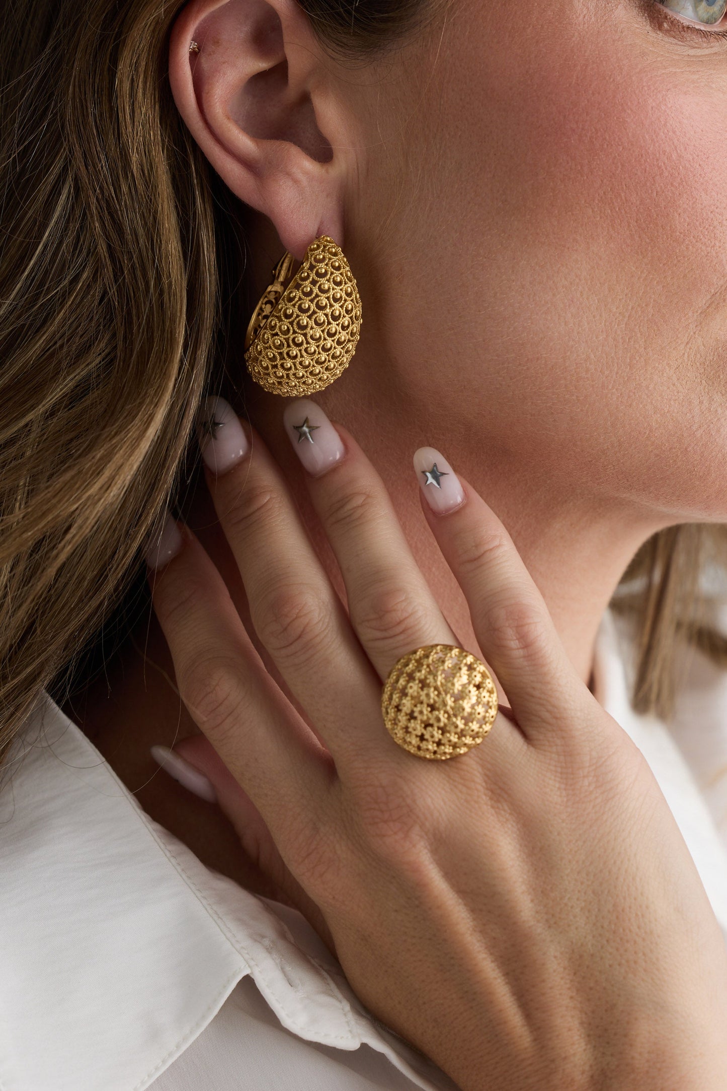 Model wearing Meadow Earrings in gold with woven texture detailing, additional model close-up on neutral background