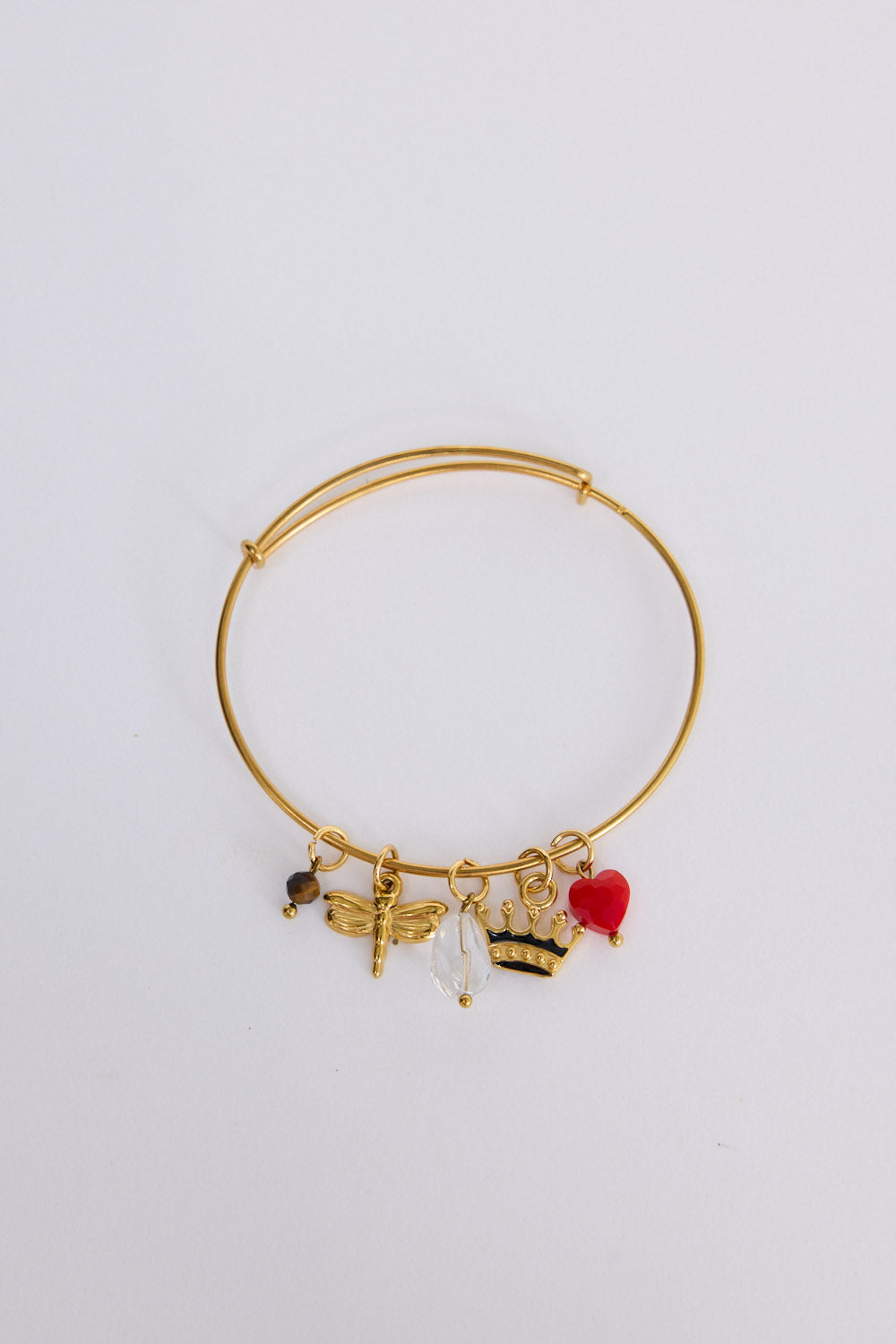 Crown Bracelet in gold with multiple charm detailing, front view on white background
