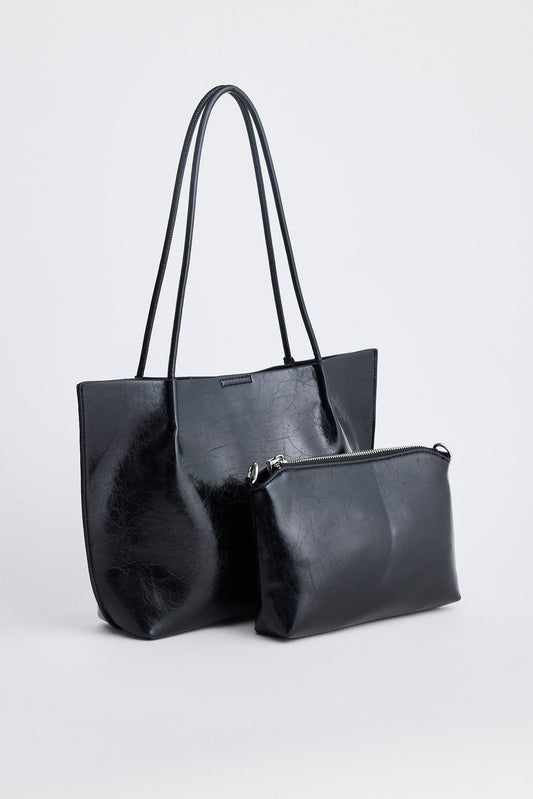 Black handbag with a matching pouch on a white background