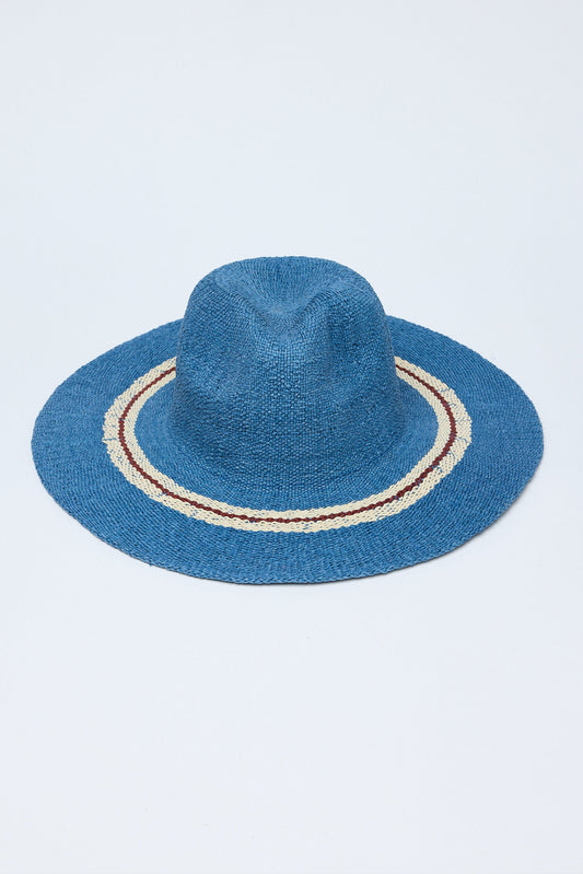 Blue straw hat with a decorative band on a white background