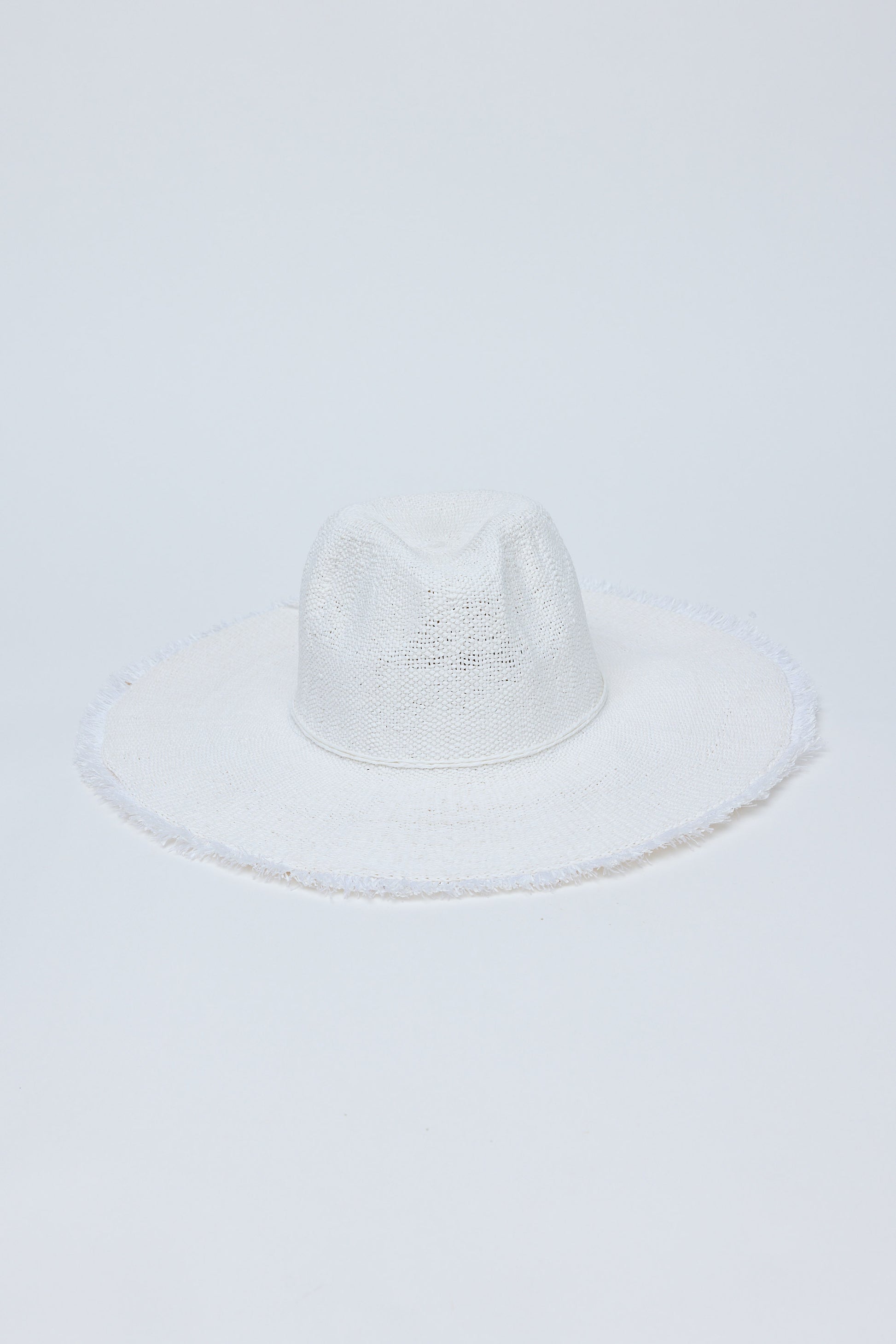 White straw hat on a light gray background