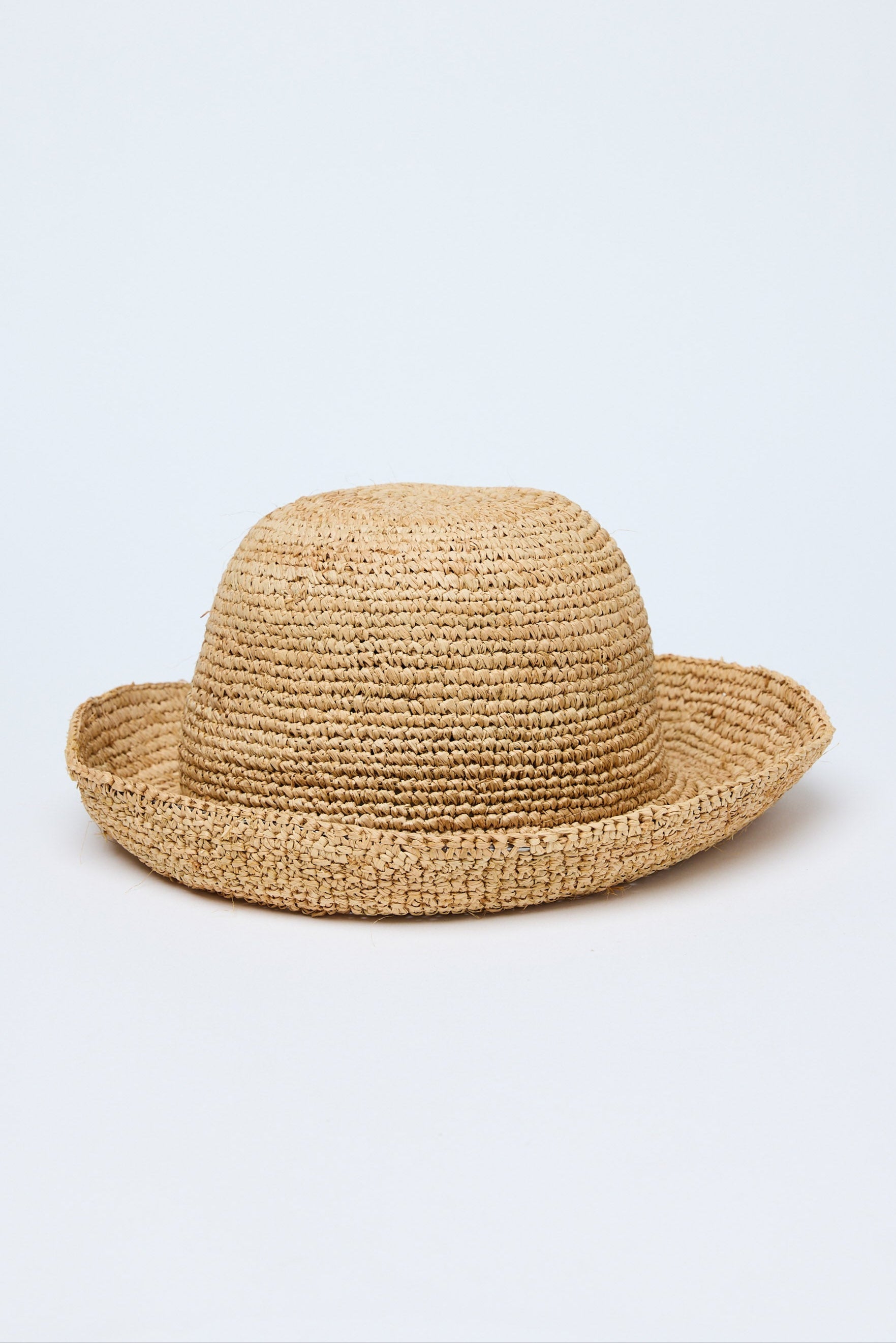 Beige straw hat on a light gray background