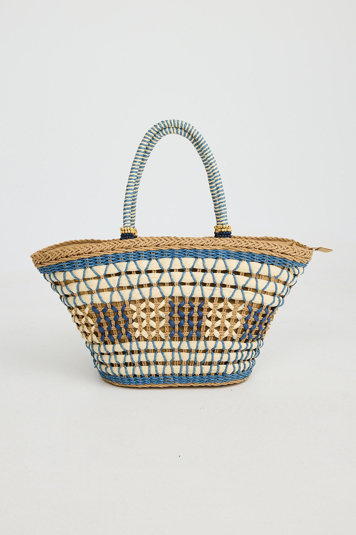 Woven handbag with striped pattern on a light gray background