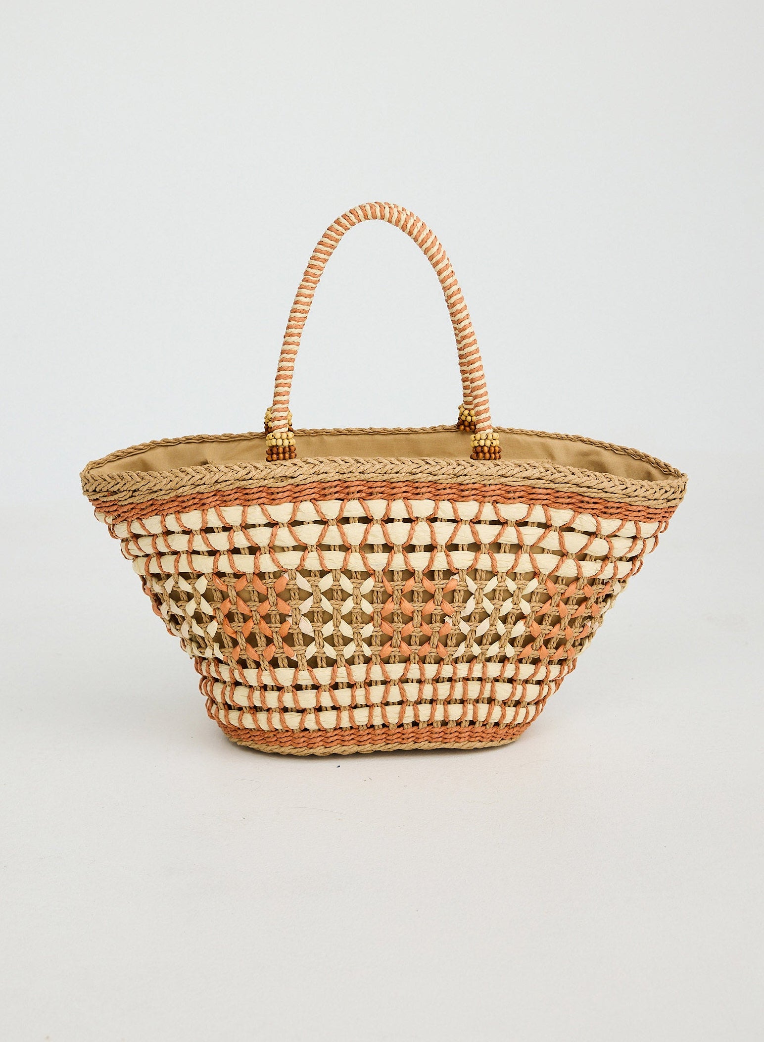 Woven basket with diamond pattern on a light gray background