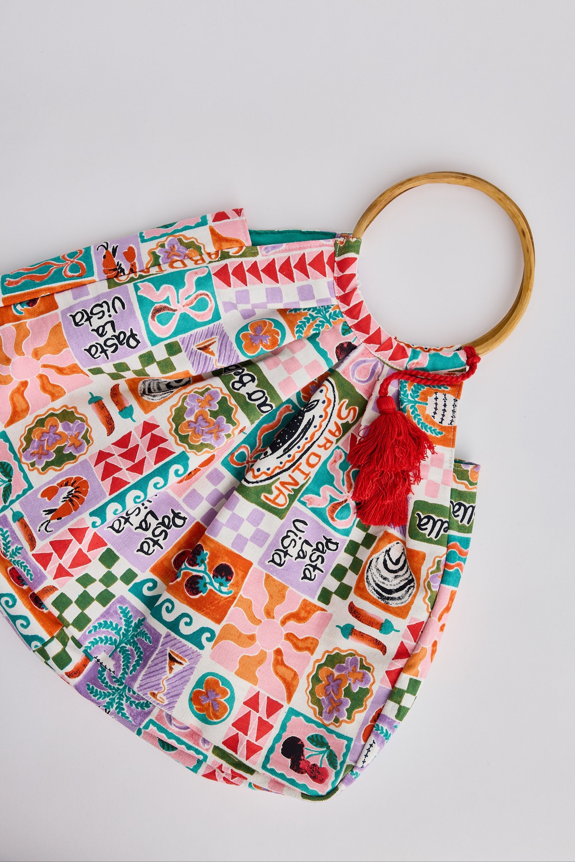 Colorful fabric headband with a tassel on a white background