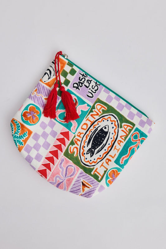 Colorful pouch with tassels on a light gray background