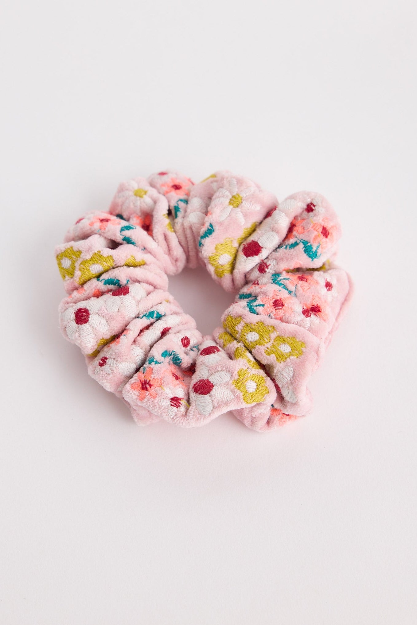 Floral scrunchie on a light pink background