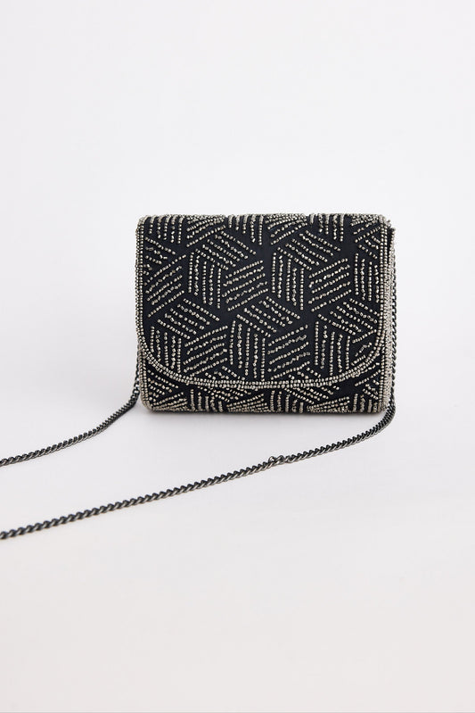 Black beaded handbag with geometric pattern on a white background