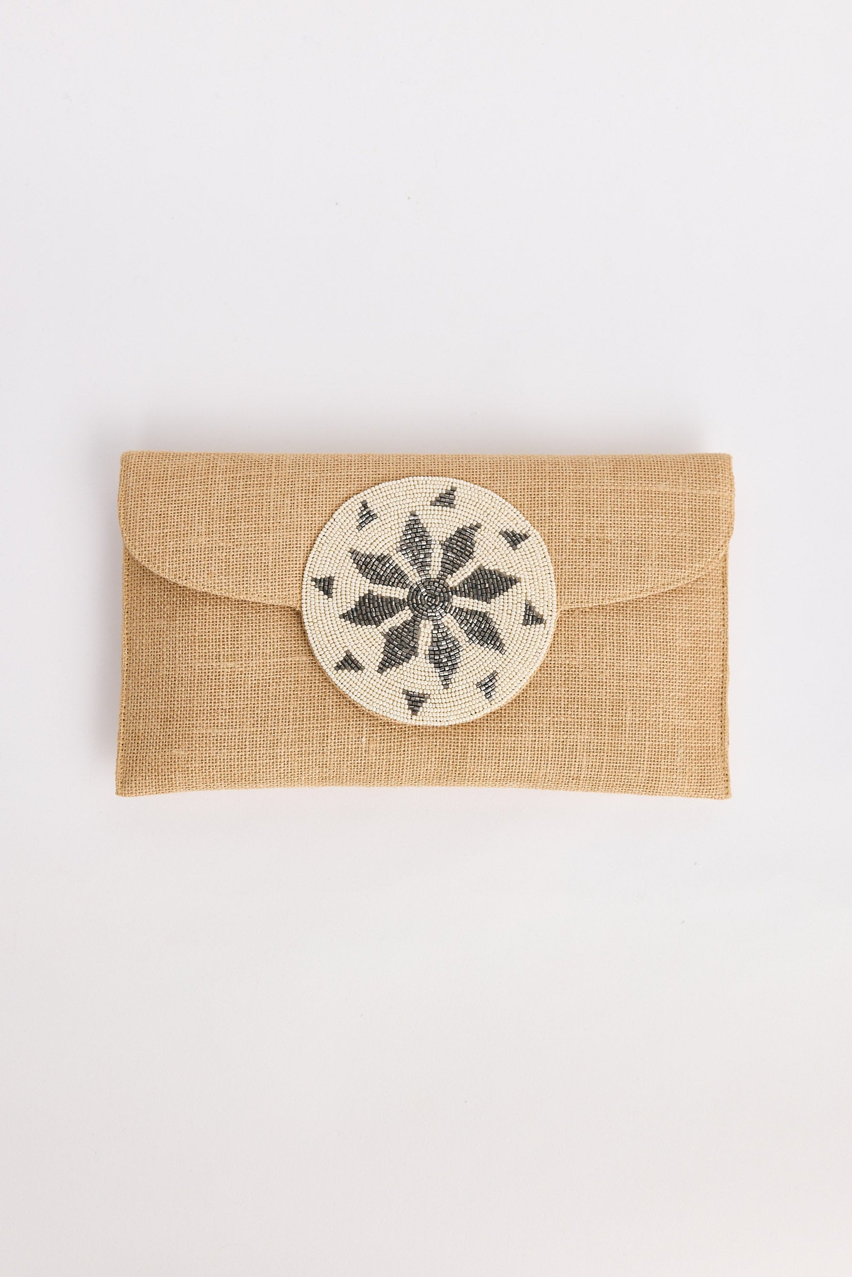 Beige fabric pouch with a round decorative patch on a white background