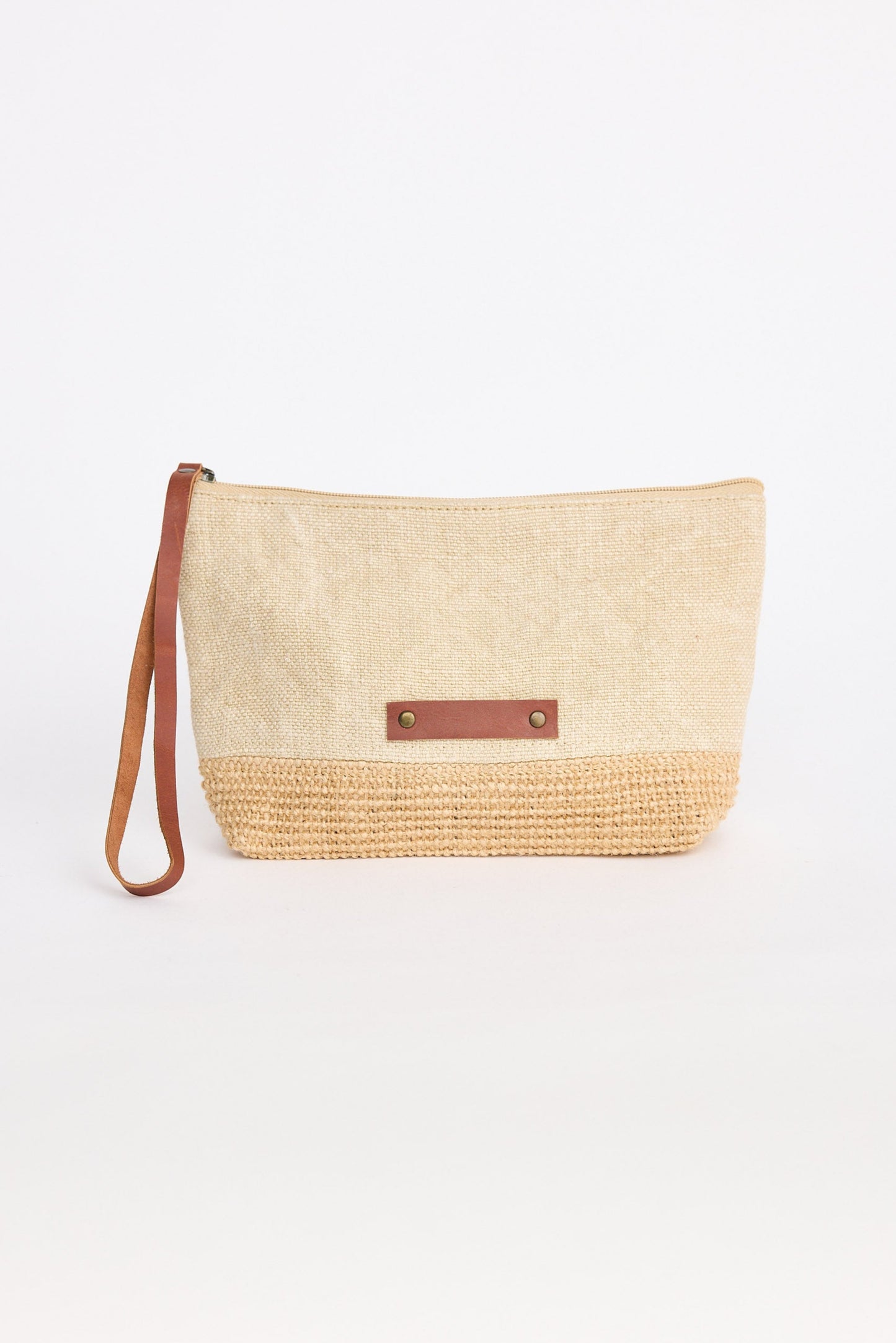 Woven clutch bag with leather strap on a white background