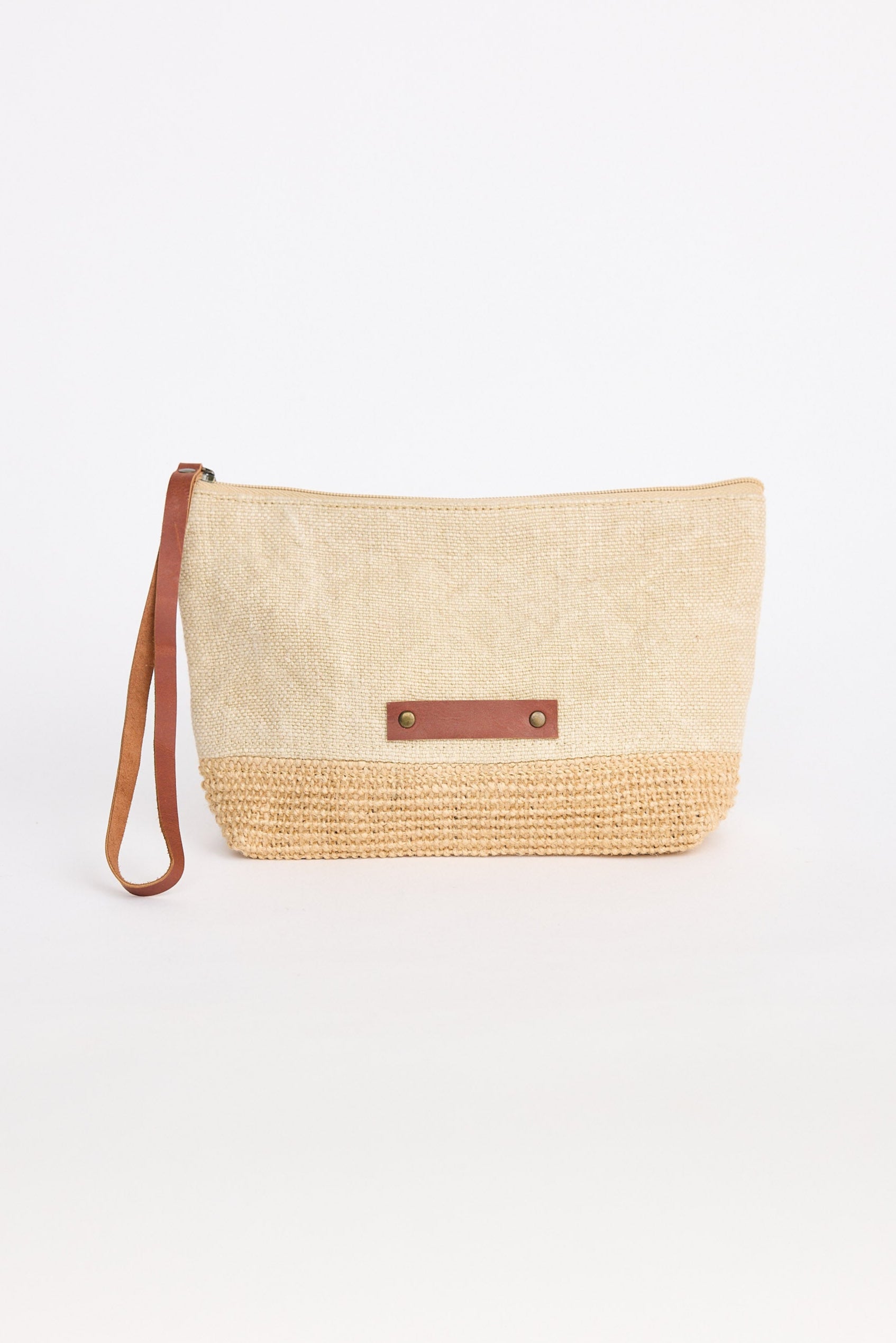 Woven clutch bag with leather strap on a white background