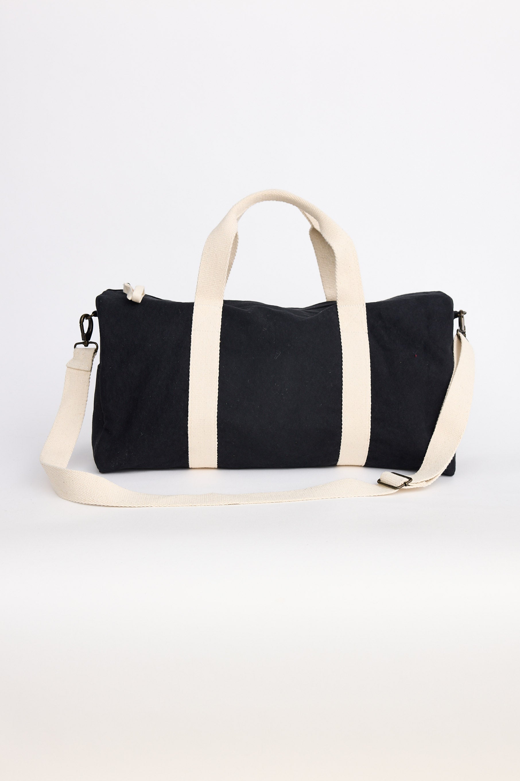 Black and white duffel bag on a white background