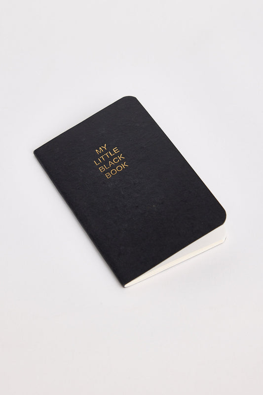 Black notebook with 'My Little Black Book' text on a white background