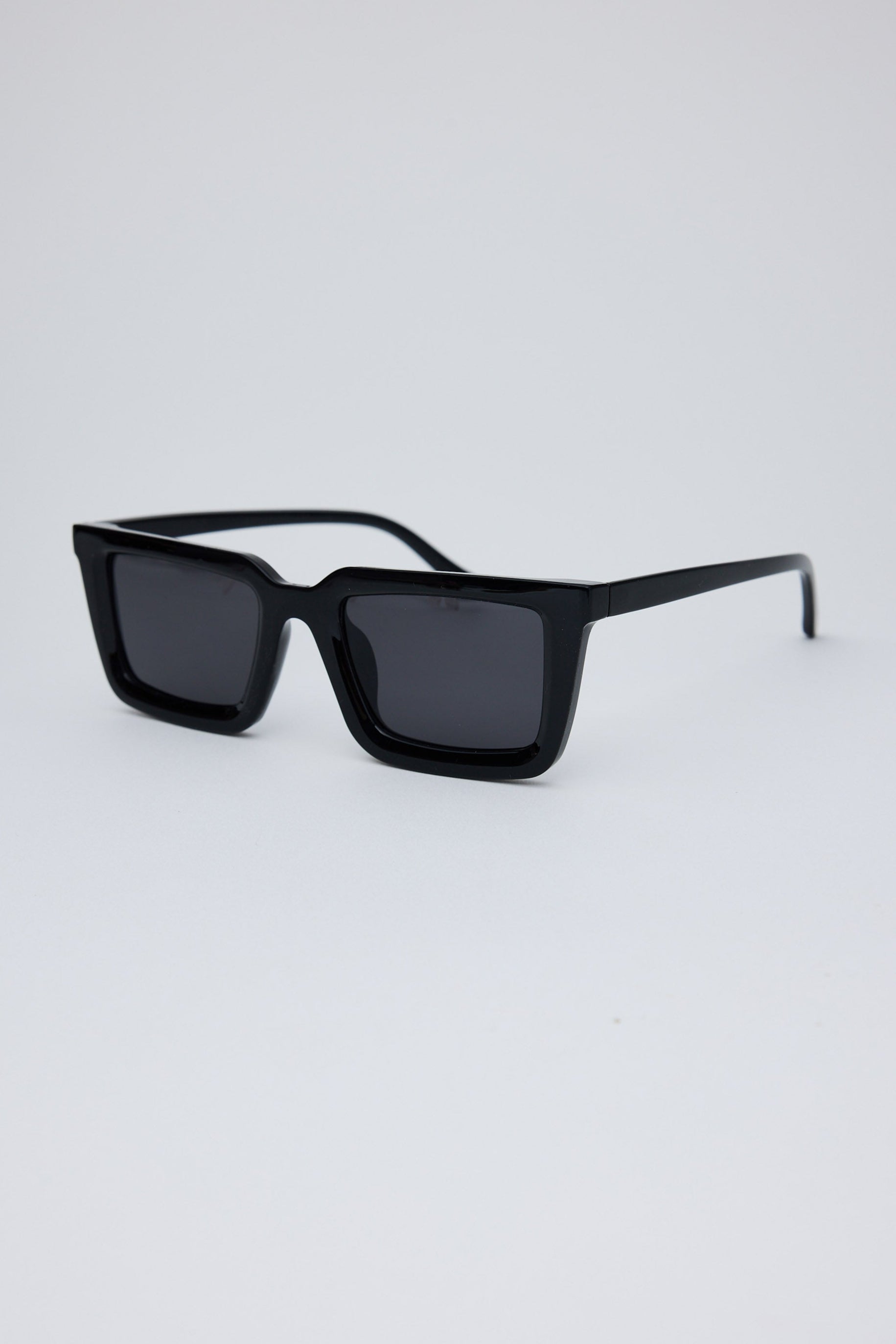 Black sunglasses on a light gray background