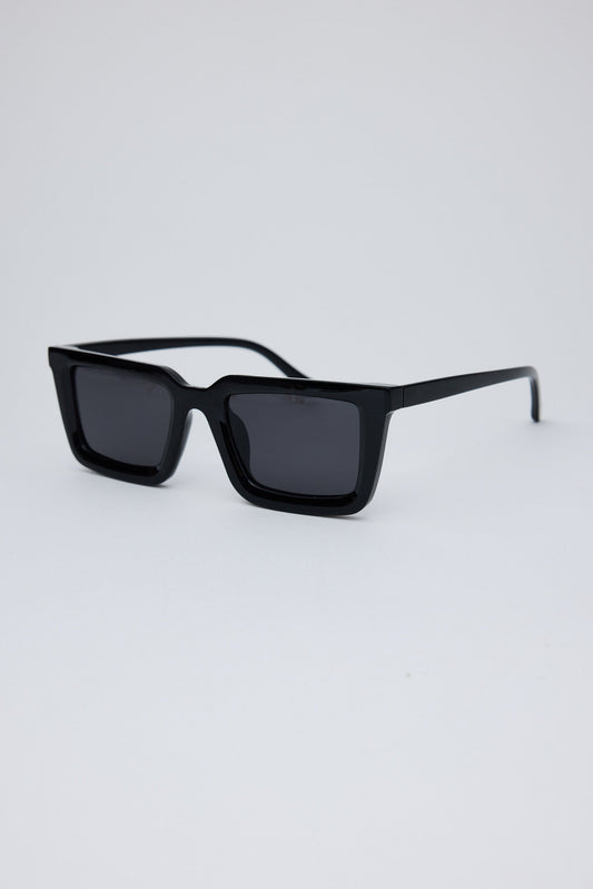 Black sunglasses on a light gray background