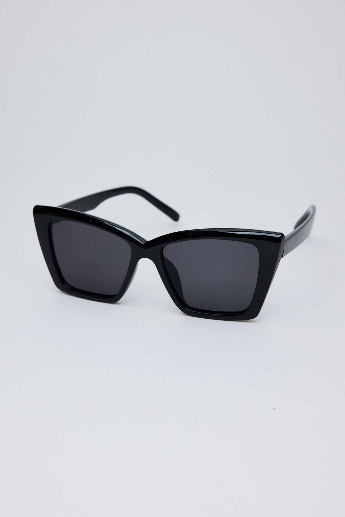 Black sunglasses on a light gray background