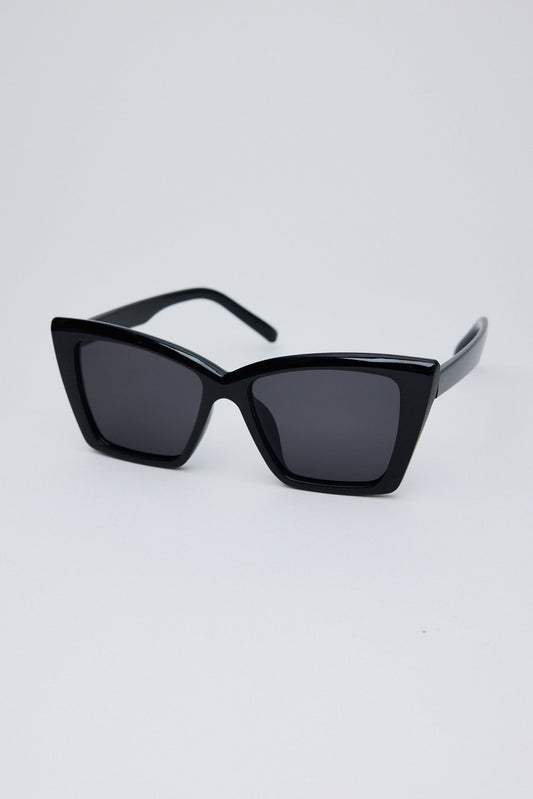 Black sunglasses on a light gray background