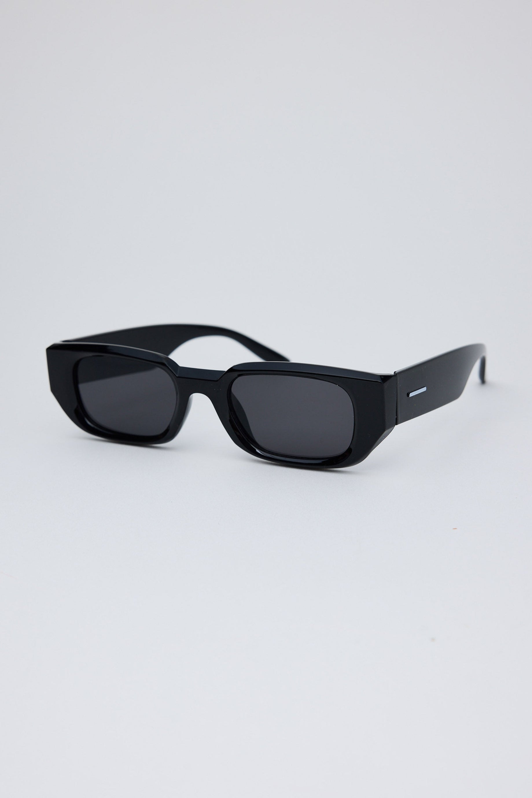 Black sunglasses on a light gray background