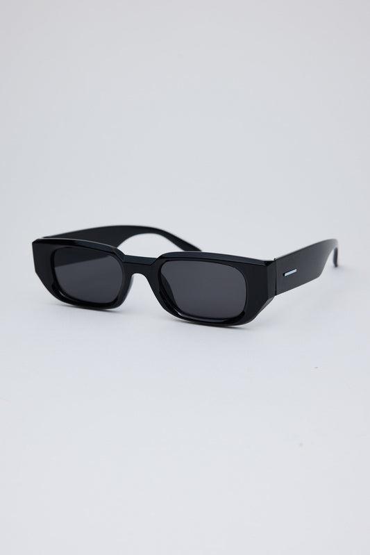 Black sunglasses on a light gray background
