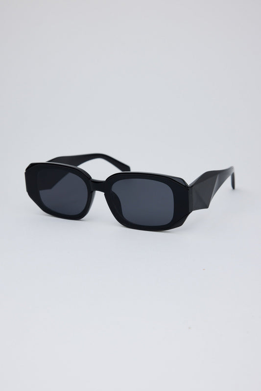 Black sunglasses on a light gray background