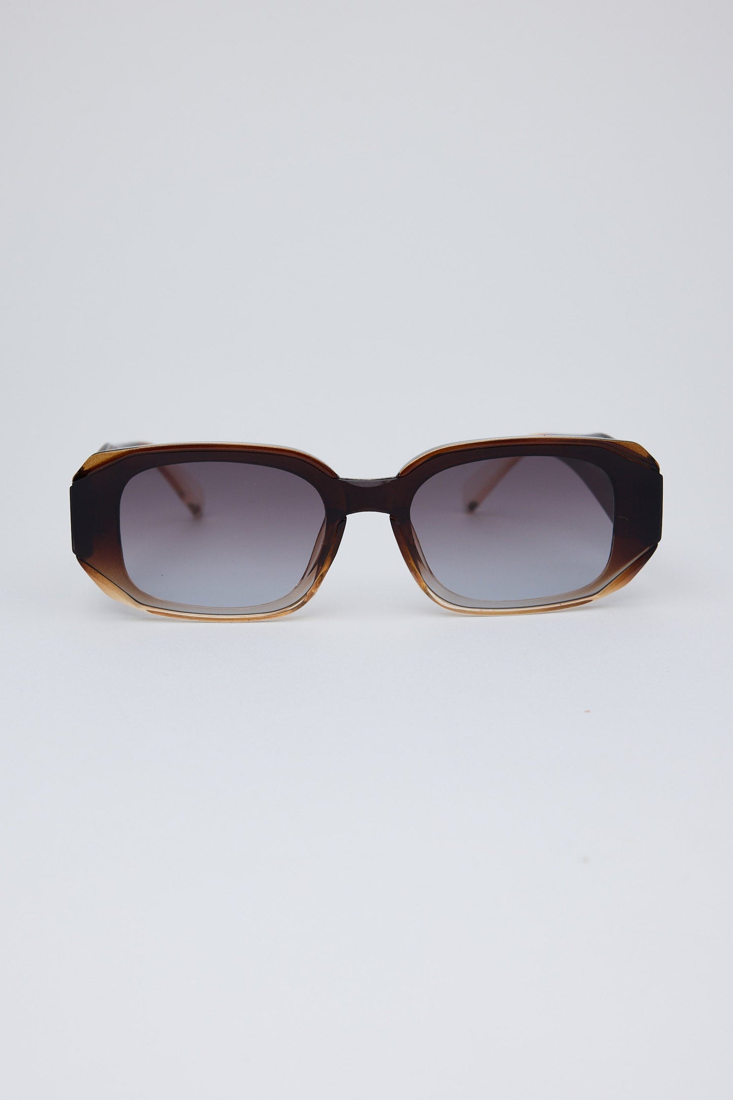 Sunglasses with a tortoiseshell frame on a white background